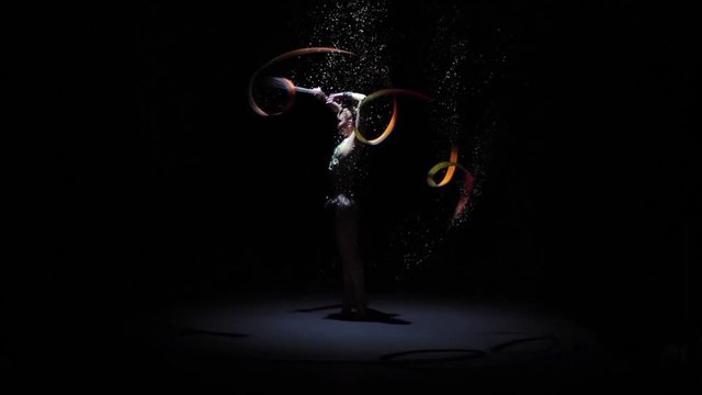 Computer graphics, rhythmic gymnast doing acrobatic moves with the ribbon