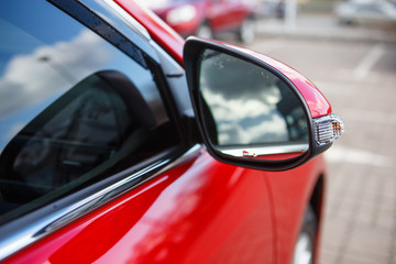 Car mirror red car