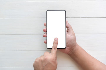 man hand holding the phone tablet on white wood background