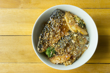 top view of rice with grilled saba fish in teriyaki