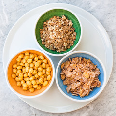 top view of various cold breakfast cereal in bowls
