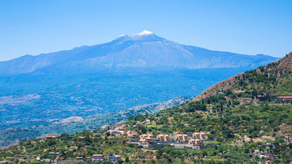 Fototapeta na wymiar view of villages and Etna volcano in Sicily