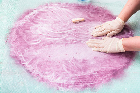 lathering the wool fibers on layout through net