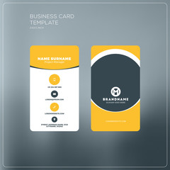 Vertical business card print template. Personal business card with company logo. Black and yellow colors. Clean flat design. Vector illustration. Business card mockup