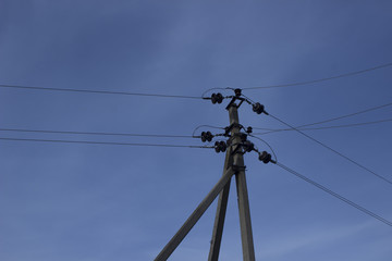 Electric poles on the sky background