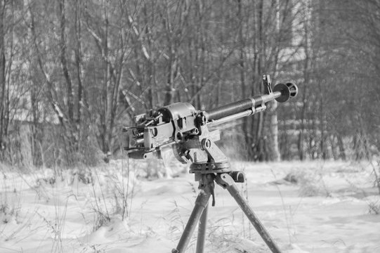 in the winter on the tripod Russian heavy machine gun, black and white.