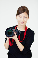 Fototapeta premium カメラを構える女性