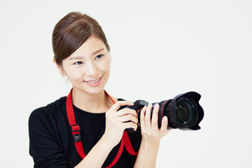 Fototapeta premium カメラを構える女性