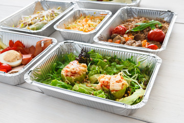 Healthy food take away in foil boxes, meat and vegetables