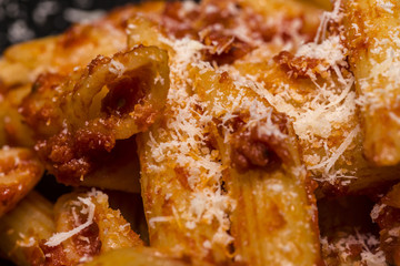 Italian food - Penne al'arrabbiata (Angry Pens), a classic italian pasta recipe with spicy tomato sauce, red hot peppers and parsley.