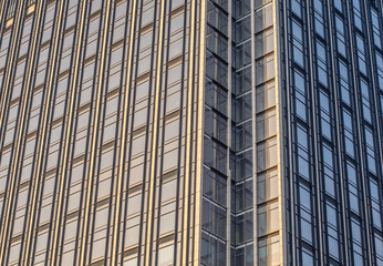 Extreme Architectural Close Up of Exterior of Modern Glass Commercial Office Building with Multiple Floors