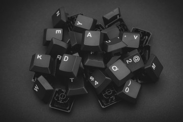 Heap of black computer keyboard keys