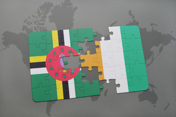 puzzle with the national flag of dominica and cote divoire on a world map