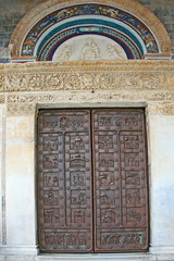 Fototapeta na wymiar Rear (external) doors to the Cathedral of Pisa, Italy.