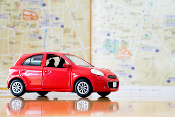 Fototapeta premium Toy red car on vacation