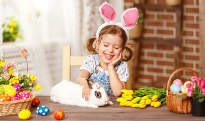 happy easter! happy funny child girl playing with bunny