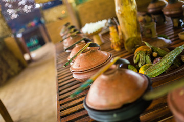 Buffet with wooden bowls at a local restaurant in Kandy, Sri Lanka