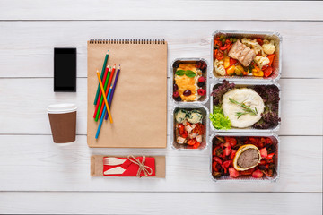 Healthy food, lunch in foil box on student table, diet