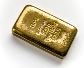 Cast gold bar weighing 250 grams on the white background.