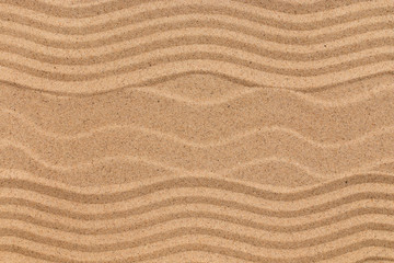Fototapeta na wymiar Beautiful patterns on the beach sand.