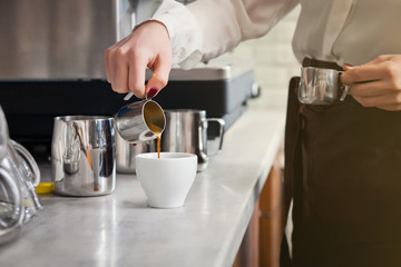Obraz na płótnie Canvas barista is preparing coffee on coffee machine