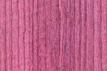 Softened board wall with bright red paint