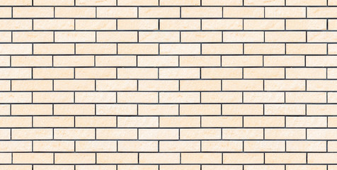 Seamless beige new and clean brick wall texture or background