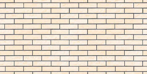 Seamless beige new and clean brick wall texture or background