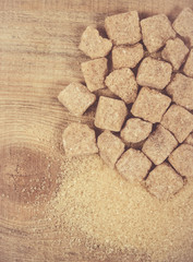 Fototapeta na wymiar Cubes of sugar - brown sugar cane.