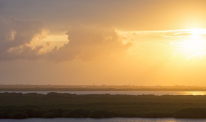 Yellow sky. Sunset over the Caribbean coast. Image taken from high level. Beautiful wallpaper.