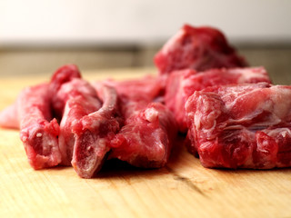 raw pork bones with meat, closeup, shallow depth of field