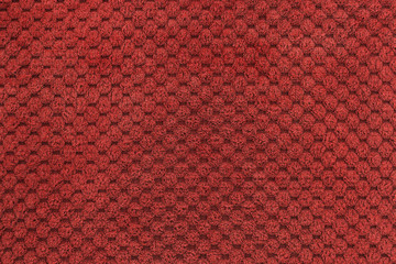 Background with red texture, velvet fabric, full frame, close-up