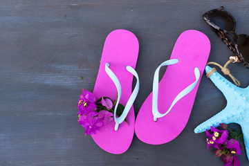 Summer beach fun - frame of sandals with glasses and starfish
