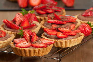 Homebaked Strawberry Tartlets With Ganache. Decorated.