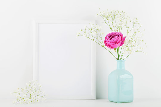 Mockup of picture frame decorated rose flower in vase on white background with clean space for text and design your blogging.