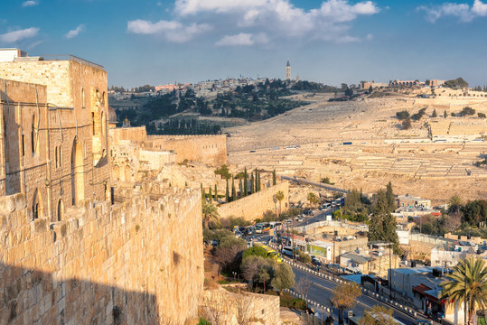 Old City wall in Jerusalem Old City and Mount of Olives in the background, Israel.