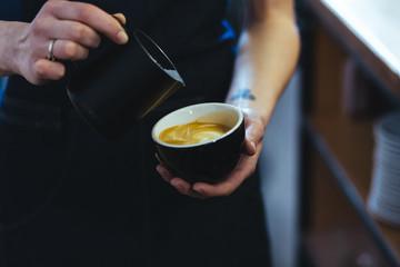 Barista making fresh coffee capuccino. Coffee Preparation Service Concept