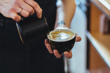 Barista making fresh coffee capuccino. Coffee Preparation Service Concept