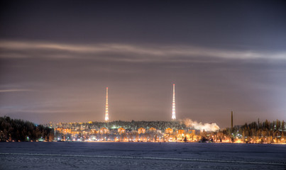 Two radio towers on top of the hill