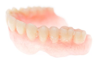 Fototapeta na wymiar false teeth on a white background