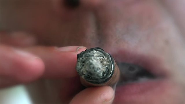 Man Cigar Smoking closeup. Cuba.