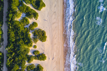 View from above, stunning aerial view of a beautiful and uncontaminated wild beach bathed by a...