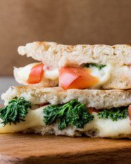 Turkish Bazlama Tost / Toast sandwich with melted cheese, tomatoes and dill.