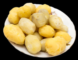 boiled potatoes on a black background