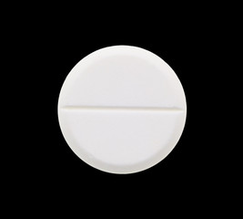 Medical tablets on a black background