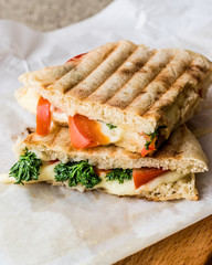 Turkish Bazlama Tost / Toast sandwich with melted cheese, tomatoes and dill.