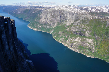 Norwegian fjord from the top of the mountain in bright day