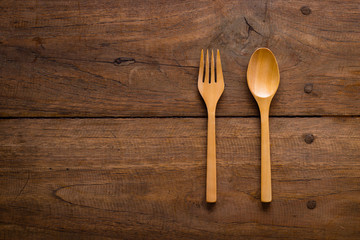 Wooden fork and spoon on wooden table
