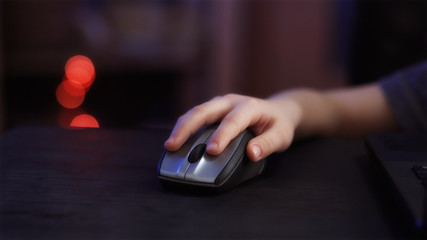 child's hand with computer mouse