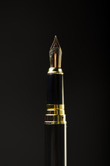 Black pen on a dark background